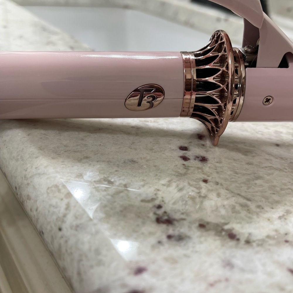 T3 Twirl 1.25’ curling iron. Like new